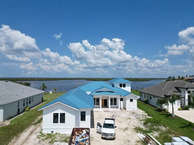 Blue metal roof on a waterfront home